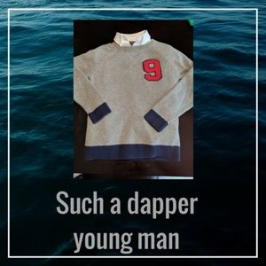 Boy's sweater and buttoned shirt